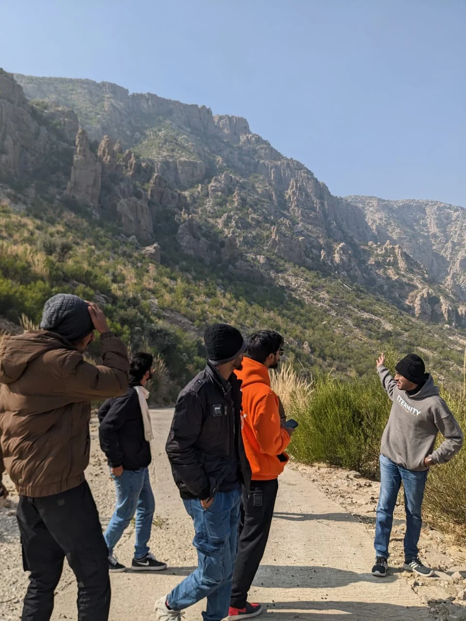 Friends exploring a rocky mountain landscape